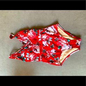 Bright, floral one piece. Lace front and scoop back. Never worn